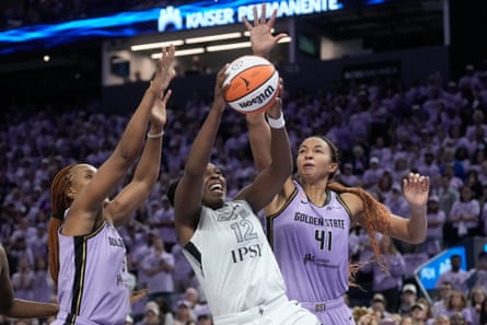 Las Vegas Aces guard Chelsea Gray shoots against Golden State Valkyries defenders Kayla Thornton and Kiah Stokes during Game 2 of the WNBA semi-finals in San Francisco on Wednesday.