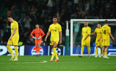 Bodo/Glimt's Daniel Bassi and teammates look dejected after Sporting's Rafael Nel scored their fifth goal.