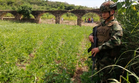 Colombian soldier provides security during a tribute for victims killed in the old crematorium ovens of Juan Frio, Norte de Santander, Colombia.