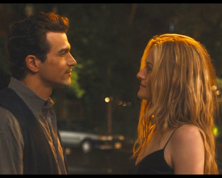 The couple standing in the street staring at each other