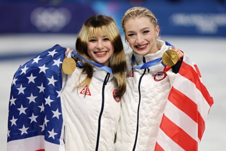 Alysa Liu, left, and Amber Glenn pose after winning Olympic gold in the team event last month in Milan.