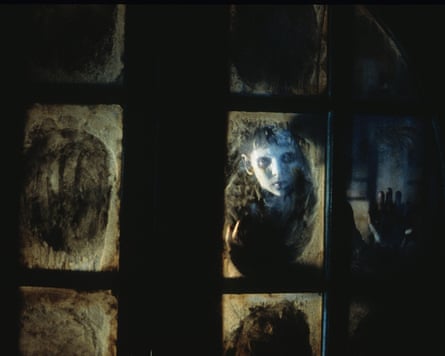 ghostly boy looks through window pane