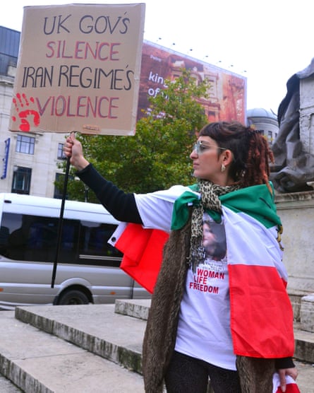 A protester in Manchester following the death of Mahsa Amini for not wearing the hijab in accordance with government rules in Iran in 2022.