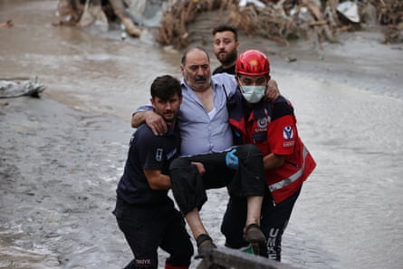 Rescuers evacuate am injured man in the Bozkurt district of Kastamonu, Turkey.