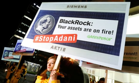 Greenpeace demonstrators protest in front of a BlackRock office in Frankfurt, Germany, in February 2020.
