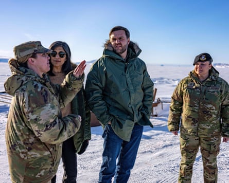 JD and Usha Vance with US air force staff, standing in a snowy area