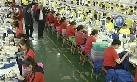 File photo from video footage run by China’s CCTV of Muslim trainees in a garment factory in Xinjiang