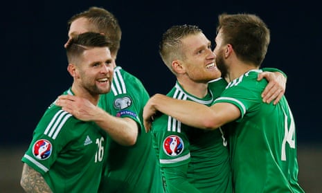 Steven Davis celebrates with teammates at the end of the match.