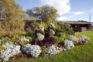 Newport, Wales. Pandas made from plants in a flower bed on a motorway roundabout