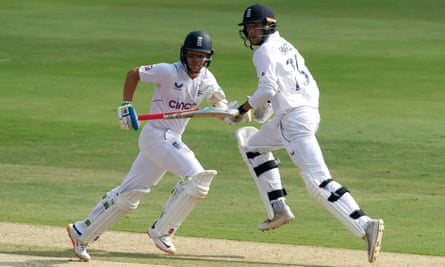 Tom Hartley (right) and Ollie Pope running between the wickets.