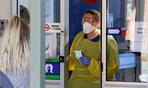 A nurse speaks with patients at a coronavirus clinic in Adelaide