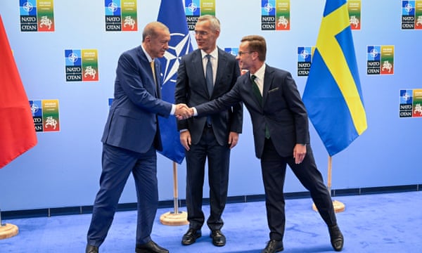 Turkish president Recep Tayyip Erdoğan and Swedish prime minister Ulf Kristersson shake hands next to Nato Secretary-General Jens Stoltenberg prior to their meeting, on the eve of a Nato summit in Vilnius, Monday 10 July 2023.