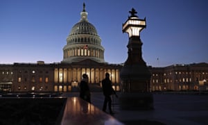 The sun sets behind the US Capitol during the first evening of Donald Trump’s impeachment trial, on Tuesday.