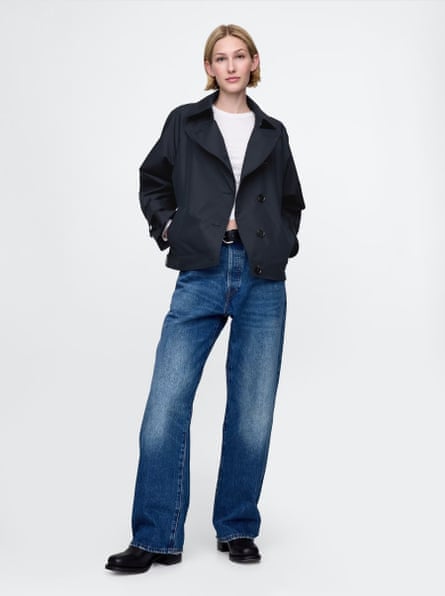 A model wearing navy cropped trench
