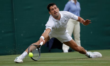 Novak Djokovic stretches for a return.