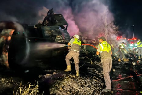 Firefighters douse the flames at the site of an overnight Israeli strike in the al-Msayleh area in southern Lebanon.