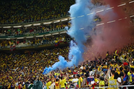 Colombia fans celebrate with flares in the stands