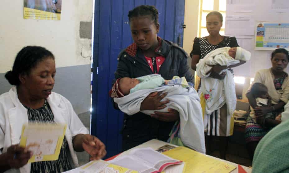 Babies are brought to be vaccinated against measles at a health clinic in Madagascar