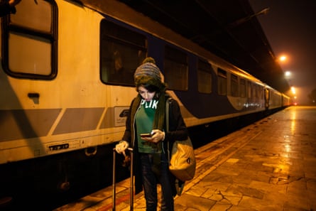 Zeinab at the train station on a long journey to Tehran for a game.