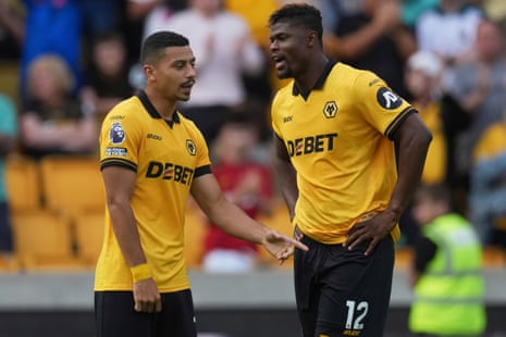 Andre talks to Wolverhampton Wanderers' Emmanuel Agbadou.