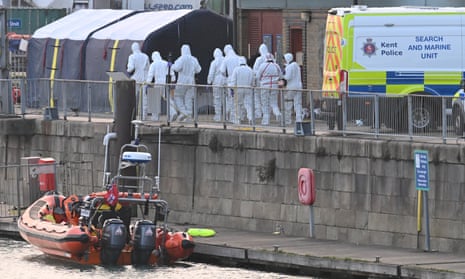 Forensics officers arrive at the RNLI lifeboat station in Dover harbour on Wednesday.