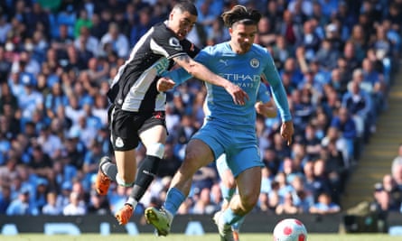 Jack Grealish of Manchester City in action with Newcastle’s Miguel Almirón during the Premier League match.