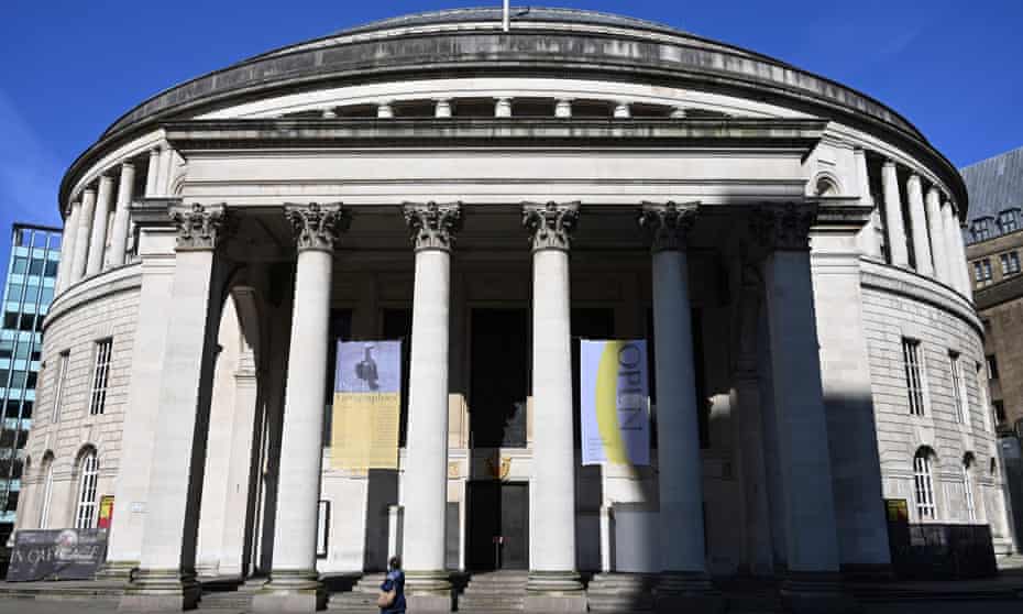A person walks past a closed Manchester central library during lockdown.