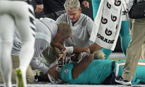 Tua Tagovailoa is treated on the field after suffering a concussion against the Bengals