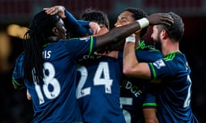 Swansea City’s players celebrate leading Arsenal.