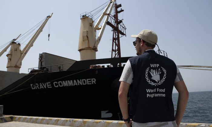 A member of staff for World Food Programme looks on as the MV Brave Commander carrying grain from Ukraine arrives in Djibouti.