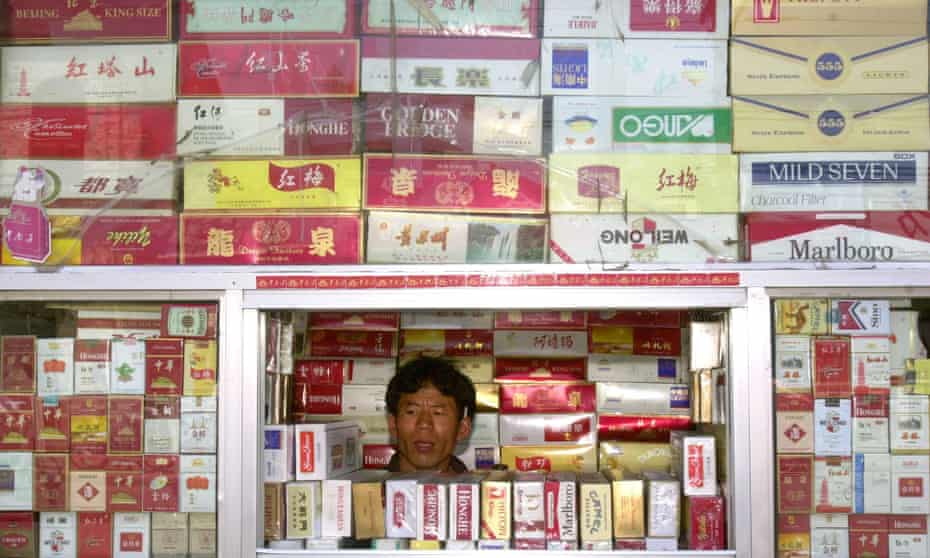 A cigarette vendor at a Beijing stall. Nearly 50% of men in China smoke but just 2% of women.