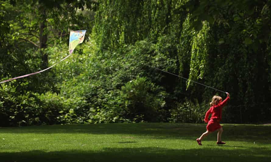 Flying a kite in Greenwich Park flower gardens