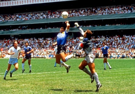Diego Maradona punches the ball past Peter Shilton in the 1986 World Cup quarter-final at the Azteca Stadium