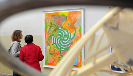 Visitors stand in front of Abu Hureyra, 2000, by Frank Stella, at a show in Jena, Germany.