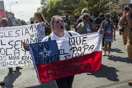A woman holds a Chilean flag during a demonstration against Pope Francis’s visit to Santiago, Chile, on 16 January 2018.