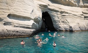 Snorkellers at Kleftiko caves, Milos, Greece.