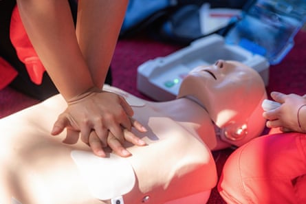 First aid CPR training with manikin.