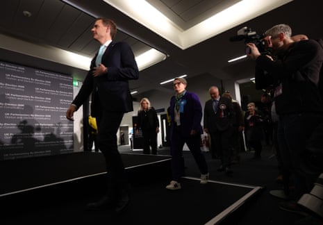 Reform UK candidate Matt Goodwin and Conservative candidate Charlotte Cadden arrive for the declaration after the vote count