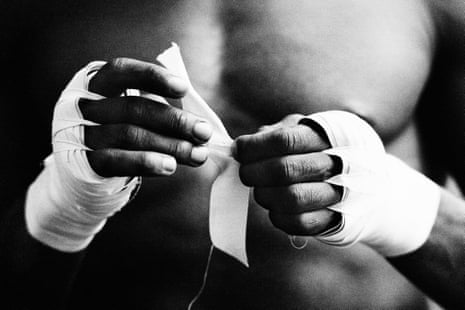 Sylvester Mittee taping his hands before a training session at Frank Warren’s boxing gym in King’s Cross, London, 1984