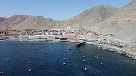 A cluster of buildings on the coast of a desert