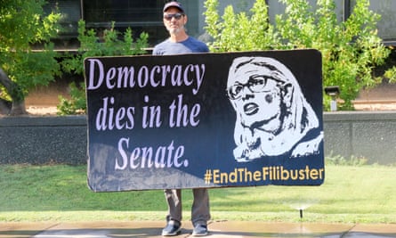A protester outside Sinema’s office in Phoenix.