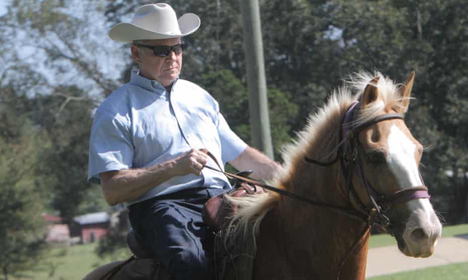Roy Moore leaves his polling place on a horse.
