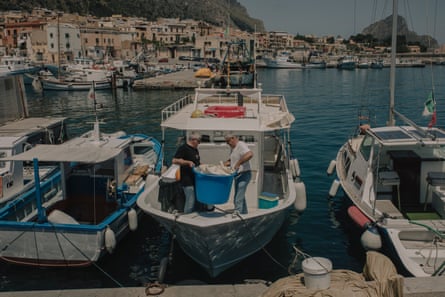 Franco and Gaetano Balestrieri on a fishing boat.