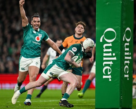 A Quilter logo wraps the post of an international rugby game