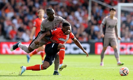Tottenham Hotspur's Yves Bissouma fouls Luton Town's Chiedozie Ogbene and gets a booking.