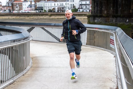 The Filter’s Kieran Agler running across a pedestrian bridge in London