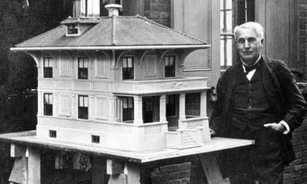 Thomas Edison stands by a model of his prototypical all-concrete house in 1910.