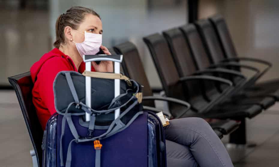 A masked traveller at Schiphol airport