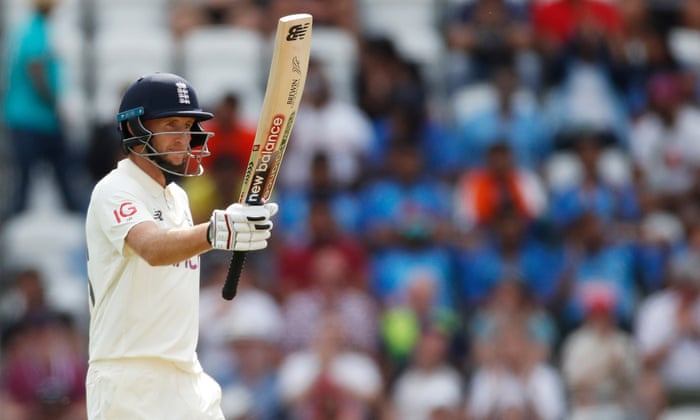England’s Joe Root celebrates his half century.