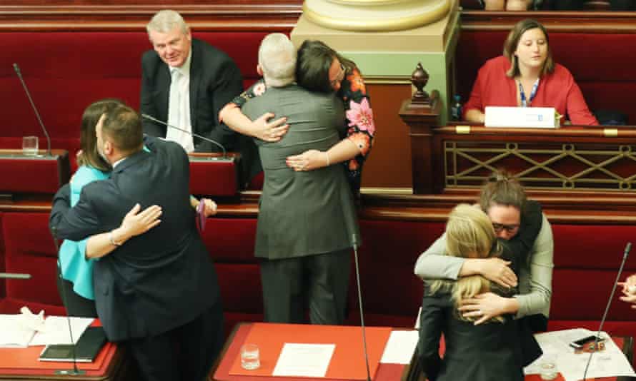MPs in Victoria, Australia, embrace after the passing of the Voluntary Assisted Dying Bill in 2017.